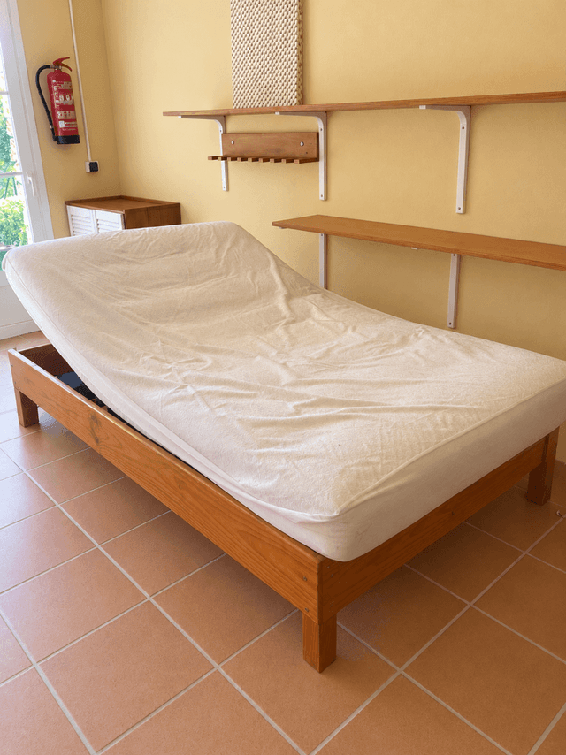 Electric adjustable bed with a wooden frame